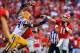 Sep 28, 2013; Athens, GA, USA; Georgia Bulldogs quarterback Aaron Murray (11) throws under pressure from LSU Tigers defensive end Danielle Hunter (94) in the second half at Sanford Stadium. Georgia won 44-41. Mandatory Credit: Daniel Shirey-USA TODAY Spor
