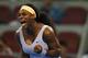 BEIJING, CHINA - SEPTEMBER 29: Serena Williams of the United States of America celebrates a point during her women's singles first round match against Elena Vesnina of Russia during day two of the 2013 China Open at the National Tennis Center on Septembe
