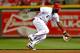 CINCINNATI, OH - SEPTEMBER 23: Brandon Phillips #4 of the Cincinnati Reds fields a ground ball from Eric Young #22 of the New York Mets at Great American Ball Park on September 23, 2013 in Cincinnati, Ohio. Cincinnati defeated New York 3-2 in 10 innings.