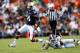 AUBURN, AL - SEPTEMBER 14: Nick Marshall #14 of the Auburn Tigers breaks a tackle by Jamerson Love #5 of the Mississippi State Bulldogs at Jordan-Hare Stadium on September 14, 2013 in Auburn, Alabama. (Photo by Kevin C. Cox/Getty Images)