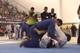 Maia is in half guard with a knee shield in.
