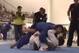 Gonzaga lowers his weight to smash Maia's knee shield. Maia forces Gonzaga's head out, a key principle in Maia's jiu-jitsu.