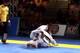 As Jacare retracts his left arm, Maia pushes it out and kicks his own left leg out behind him, attacking Jacare's right leg while his hands are out of the way.