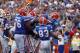 Sep 21, 2013; Gainesville, FL, USA; Florida Gators quarterback Tyler Murphy (3) is congratulated by teammates after he ran the ball in for a touchdown against the Tennessee Volunteers during the second half at Ben Hill Griffin Stadium. Florida Gators defe