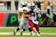 ORLANDO, FL - SEPTEMBER 28: Connor Shaw #14 of the South Carolina Gamecocks fumbles the ball after being hit by Terrance Plummer #41 of the Central Florida Knights during a game at Bright House Networks Stadium on September 28, 2013 in Orlando, Florida.