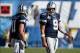 Sep 29, 2013; San Diego, CA, USA; Dallas Cowboys quarterback Tony Romo (9) and wide receiver Cole Beasley (11) during a timeout in the fourth quarter against the San Diego Chargers at Qualcomm Stadium. Mandatory Credit: Robert Hanashiro-USA TODAY Sports
