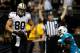 NEW ORLEANS, LA - SEPTEMBER 30: Jimmy Graham #80 of the New Orleans Saints scores a touchdown over Chris Clemons #30 of the Miami Dolphins at the Mercedes-Benz Superdome on September 30, 2013 in New Orleans, Louisiana. (Photo by Chris Graythen/Getty Im
