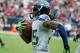 HOUSTON, TX - SEPTEMBER 29: Richard Sherman #25 of the Seattle Seahawks returns an interception 58 yaerds for a touchdown in the second half against the Houston Texans at Reliant Stadium on September 29, 2013 in Houston, Texas. (Photo by Scott Halleran