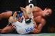 August 11, 2012; Denver, CO, USA; Jake Shields (top) fights Ed Herman (bottom) during UFC 150 at the Pepsi Center. Mandatory Credit: Ron Chenoy-USA TODAY Sports