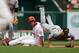 Sep 8, 2013; St. Louis, MO, USA; Pittsburgh Pirates second baseman Neil Walker (18) falls over St. Louis Cardinals left fielder Matt Holliday (7) as he attempts to turn a double play at Busch Stadium. Mandatory Credit: Scott Kane-USA TODAY Sports