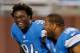 DETROIT, MI - SEPTEMBER 08: Ezekiel Ansah #94 of the Detroit Lions is all smiles behind Ndamukong Suh #90 during pre game prior to playing the Minnesota Vikings at Ford Field on September 8, 2013 in Detroit, Michigan. (Photo by Gregory Shamus/Getty Images