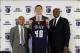 Jun 28, 2013; Charlotte, NC, USA; Charlotte Bobcats first round draft pick Cody Zeller (middle), general manager Rich Cho (left), and president of basketball operations Rod Higgins (right) hold up jersey during the introduction press conference at Time W