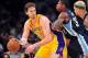 April 5, 2013; Los Angeles, CA, USA; Los Angeles Lakers power forward Pau Gasol (16) moves the ball against the defense of Memphis Grizzlies power forward Ed Davis (32) during the first half at Staples Center. Mandatory Credit: Gary A. Vasquez-USA TODAY S