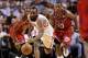 Feb 6 2013; Miami, FL, USA; Houston Rockets shooting guard James Harden (13) chases a loose ball as Miami Heat shooting guard Dwyane Wade (3) and Miami Heat point guard Mario Chalmers (15) both defend the play in the second half at American Airlines Aren
