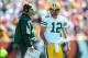 Sep 22, 2013; Cincinnati, OH, USA; Green Bay Packers head coach Mike McCarthy talks with quarterback Aaron Rodgers (12) during the second quarter against the Cincinnati Bengals at Paul Brown Stadium. Mandatory Credit: Andrew Weber-USA TODAY Sports