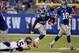 Sep 15, 2013; East Rutherford, NJ, USA; New York Giants running back David Wilson (22) runs past Denver Broncos cornerback Dominique Rodgers-Cromartie (45) during the first half at MetLife Stadium. Mandatory Credit: Robert Deutsch-USA TODAY Sports