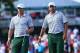 Oct 3, 2013; Dublin, OH, USA; Graham DeLaet and Jason Day on the 14th green during the Thursday four ball matches of the Presidents Cup at Muirfield Village Golf Club. Mandatory Credit: Allan Henry-USA TODAY Sports
