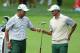 DUBLIN, OH - OCTOBER 03: Hideki Matsuyama of Japan (L) and Adam Scott of Australia and the International Team react to a shot on the second hole during the Day One Four-Ball Matches at the Muirfield Village Golf Club on October 3, 2013 in Dublin, Ohio.