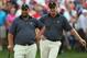 Oct 4, 2013; Dublin, OH, USA; Ernie Els and Brendon de Jonge on the 11th green during the second round of the President's Cup at Muirfield Village Golf Club. Mandatory Credit: Brian Spurlock-USA TODAY Sports