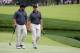 DUBLIN, OH - OCTOBER 04: Brendon de Jonge of Zimbabwe and Ernie Els of South Africa and the International Team walk to the fifth green during the Day Two Foursome Matches at the Muirfield Village Golf Club on October 4, 2013 in Dublin, Ohio. (Photo by