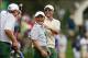 Oct 3, 2013; Dublin, OH, USA; International players Adam Scott and Hideki Matsuyama share a laugh with captain Nick Price as they walk off the 10th green as play is called for inclement weather during the Presidents Cup at Muirfield Village Golf Club. Man