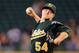 Sep 29, 2013; Seattle, WA, USA; Oakland Athletics starting pitcher Sonny Gray (54) pitches to the Seattle Mariners during the first inning at Safeco Field. Mandatory Credit: Steven Bisig-USA TODAY Sports