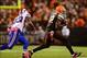 Oct 3, 2013; Cleveland, OH, USA; Cleveland Browns wide receiver Josh Gordon (12) makes a catch and looks to get away from Buffalo Bills free safety Aaron Williams (23) during the fourth quarter at FirstEnergy Stadium. Mandatory Credit: Andrew Weber-USA TO