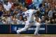 ATLANTA, GA - OCTOBER 04: Yasiel Puig #66 of the Los Angeles Dodgers hits an infield single in the sixth inning against the Atlanta Braves during Game Two of the National League Division Series at Turner Field on October 4, 2013 in Atlanta, Georgia. (Ph