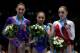 ANTWERPEN, BELGIUM - OCTOBER 05: (L-R) Kyla Ross (silver) of USA, Huang Huidan (gold) of China and Aliya Mustafina (bronze) of Russia pose with thier medals in the Uneven Bars Final on Day Six of the Artistic Gymnastics World Championships Belgium 2013