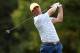 Oct 5, 2013; Dublin, OH, USA; Graham DeLaet tees off on the 18th hole during the third round of the Presidents Cup at Muirfield Village Golf Club. Mandatory Credit: Brian Spurlock-USA TODAY Sports