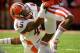 LINCOLN, NE - OCTOBER 5: Running back Ameer Abdullah #8 of the Nebraska Cornhuskers tries to break free from linebacker Jonathan Brown #45 of the Illinois Fighting Illini during their game at Memorial Stadium on October 5, 2013 in Lincoln, Nebraska. (Phot