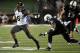 NASHVILLE, TN - OCTOBER 05: Marcus Murphy #6 of the Missouri Tigers stiff arms Javon Marshall #31 of the Vanderbilt Commodores at Vanderbilt Stadium on October 5, 2013 in Nashville, Tennessee. (Photo by Frederick Breedon/Getty Images)