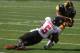 IOWA CITY, IOWA- AUGUST 31: Wide receiver Kevonte Martin-Manley #11 of the Iowa Hawkeyes is brought down during the second quarter against cornerback Jhony Faustin #5 of the Northern Illinois Huskies on August 31, 2013 at Kinnick Stadium in Iowa City, Iow