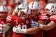 LINCOLN, NE - OCTOBER 5: Wide receiver Quincy Enunwa #18 of the Nebraska Cornhuskers celebrates a touchdown with offensive linesman Jake Cotton #68 of the Nebraska Cornhuskers and tight end Jake Long #41 of the Nebraska Cornhuskers during their game at Me