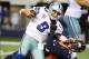Oct 6, 2013; Arlington, TX, USA; Dallas Cowboys quarterback Tony Romo (9) is sacked in the fourth quarter by Denver Broncos defensive end Shaun Phillips (90) at AT&T Stadium. The Denver Broncos beat the Dallas Cowboys 51-48. Mandatory Credit: Matthew Emm
