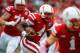 LINCOLN, NE - OCTOBER 5: quarterback Tommy Armstrong Jr. #4 of the Nebraska Cornhuskers looks for an opening in the Illinois Fighting Illini defense during their game at Memorial Stadium on October 5, 2013 in Lincoln, Nebraska. (Photo by Eric Francis/Gett