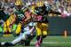Oct 6, 2013; Green Bay, WI, USA; Green Bay Packers running back Eddie Lacy (27) runs with the ball as Detroit Lions defensive tackle Andre Fluellen (96) tackels in the second quarter at Lambeau Field. Mandatory Credit: Benny Sieu-USA TODAY Sports