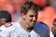 KANSAS CITY, MO - SEPTEMBER 29: Quarterback Eli Manning #10 of the New York Giants walks off the field after losing to the Kansas City Chiefs 31-7 on September 29, 2013 at Arrowhead Stadium in Kansas City, Missouri. (Photo by Peter Aiken/Getty Images)