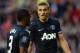 SUNDERLAND, ENGLAND - OCTOBER 05: Nemanja Vidic of Manchester United gestures to Patrice Evra of Manchester United during the Barclays Premier League match between Sunderland and Manchester United at the Stadium of Light on October 5, 2013 in Sunderland,
