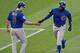 Jul 19, 2013; Denver, CO, USA; Chicago Cubs left fielder Alfonso Soriano (12) is congratulated for his home run by third base coach David Bell (3) during the fourth inning against the Colorado Rockies at Coors Field. Mandatory Credit: Ron Chenoy-USA TODAY