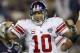 GLENDALE, AZ - FEBRUARY 03: Quarterback Eli Manning #10 of the New York Giants reacts after he threw a 5-yard touchdown pass to David Tyree #85 in the fourth quarter against the New England Patriots during Super Bowl XLII on February 3, 2008 at the Unive