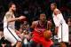 Mar. 8, 2013; Brooklyn, NY, USA; Washington Wizards point guard John Wall (2) drives to the net between Brooklyn Nets point guard Deron Williams (8) and shooting guard Joe Johnson (7) during the first half at Barclays Center. Mandatory Credit: Debby Wong-