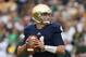SOUTH BEND, IN - SEPTEMBER 21: Tommy Rees #11 of the Notre Dame Fighting Irish looks for a receiver against the Michigan State Spartans at Notre Dame Stadium on September 21, 2013 in South Bend, Indiana. Notre dame defeated Michigan State 17-13. (Photo
