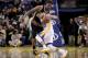 Apr 7, 2013; Oakland, CA, USA; Golden State Warriors guard Stephen Curry (30) attempts to dribble around Utah Jazz forward Derrick Favors (15) in the fourth quarter at ORACLE arena. The Jazz defeated the Warriors 97-90. Mandatory Credit: Cary Edmondson-US