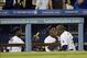 Hanley Ramirez (far left) and Yasiel Puig feed Uribe.