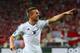 L'VIV, UKRAINE - JUNE 17: Lukas Podolski of Germany celebrates scoring their first goal during the UEFA EURO 2012 group B match between Denmark and Germany at Arena Lviv on June 17, 2012 in L'viv, Ukraine. (Photo by Alex Livesey/Getty Images)