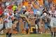 Oct 5, 2013; Knoxville, TN, USA; Tennessee Volunteers wide receiver Jacob Carter (87) leaps into the air in celebration of his teammate Tennessee defensive back Devaun Swafford (13) scoring a touchdown on a blocked punt against the Georgia Bulldogs during