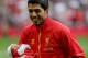 LIVERPOOL, ENGLAND - OCTOBER 05: Luis Suarez of Liverpool with his new baby prior to the Barclays Premier League match between Liverpool and Crystal Palace at Anfield on October 5, 2013 in Liverpool, England. (Photo by Clive Brunskill/Getty Images)
