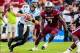 Aug 29, 2013; Columbia, SC, USA; North Carolina Tar Heels quarterback Bryn Renner (2) scrambles as he is pursued by South Carolina Gamecocks defensive end Jadeveon Clowney (7) in the second quarter at Williams-Brice Stadium. Mandatory Credit: Jeff Blake-U