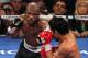 LAS VEGAS, NV - JUNE 09: (L-R) Timothy Bradley lands a left to the head of Manny Pacquiao during their WBO welterweight title fight at MGM Grand Garden Arena on June 9, 2012 in Las Vegas, Nevada. (Photo by Jeff Bottari/Getty Images)